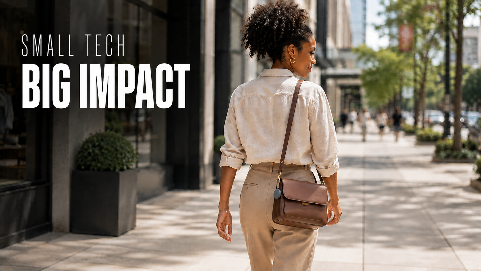 Woman walking in public with a Bluetooth tracker attached to her handbag